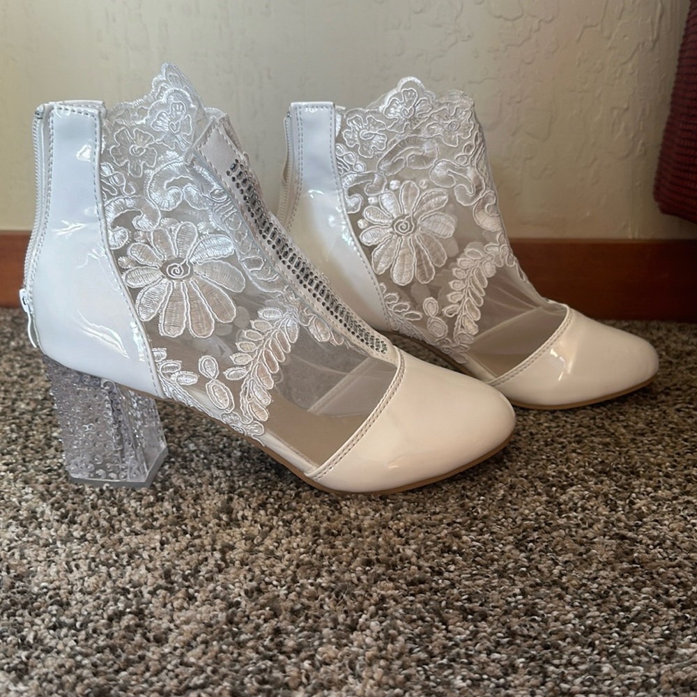 White laced and jeweled ladies heels